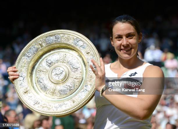 Marion Bartoli celebrates with her trophy after beating Sabine Lisicki in the Ladies Singles Final on Day 12 of the Wimbledon Lawn Tennis...
