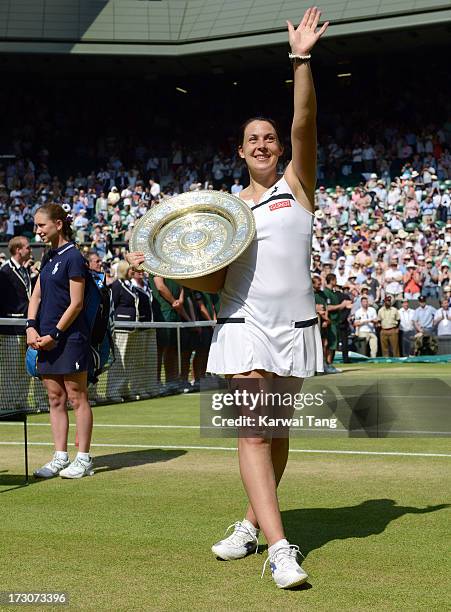 Marion Bartoli celebrates with her trophy after beating Sabine Lisicki in the Ladies Singles Final on Day 12 of the Wimbledon Lawn Tennis...