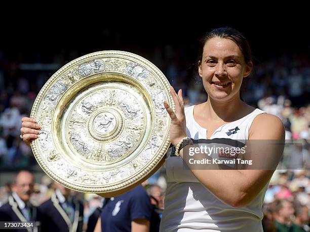 Marion Bartoli celebrates with her trophy after beating Sabine Lisicki in the Ladies Singles Final on Day 12 of the Wimbledon Lawn Tennis...