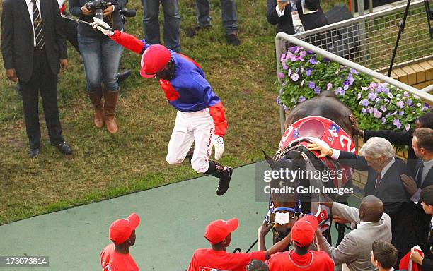 Manga Khumalo leaps from Heavy Metal in celebration of winning the President's Champions Challenge; the main race during the 2013 Vodacom Durban July...