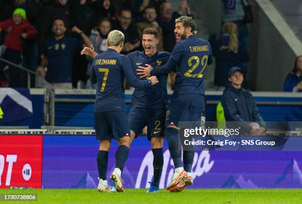 France's Benjamin Pavard celebrates making it 1-1 with teammates Antoine Griezmann and Theo Hernandez during an international friendly match between...