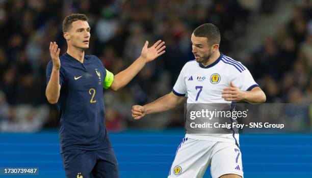 France's Benjamin Pavard and Scotland's John McGinn in action during an international friendly match between France and Scotland at Stade Pierre...