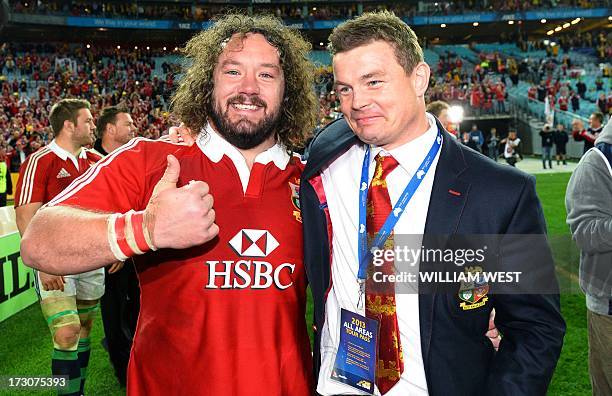 British and Irish Lions prop Adam Jones and center Brian O'Driscoll celebrate after victory of the Australian Wallabies in the third rugby Test match...