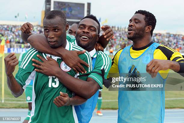 Nigerian attacker Mohammad Gambo is congratulated by his teammates after scoring a goal against Ivory Coast during the 2014 African Nations...