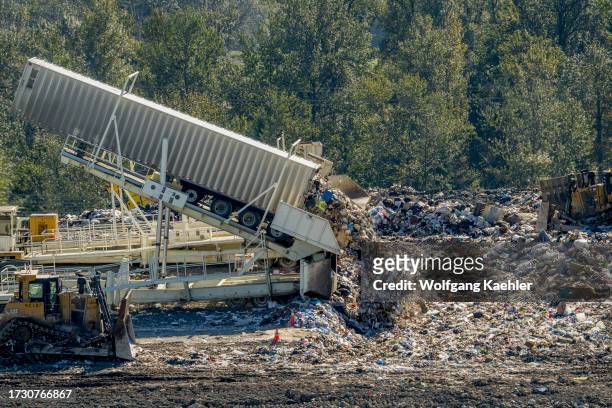 Tippers unloading garbage from transfer trailers at the King County Cedar Hills Regional Landfill facilities, operated by the King County Solid Waste...