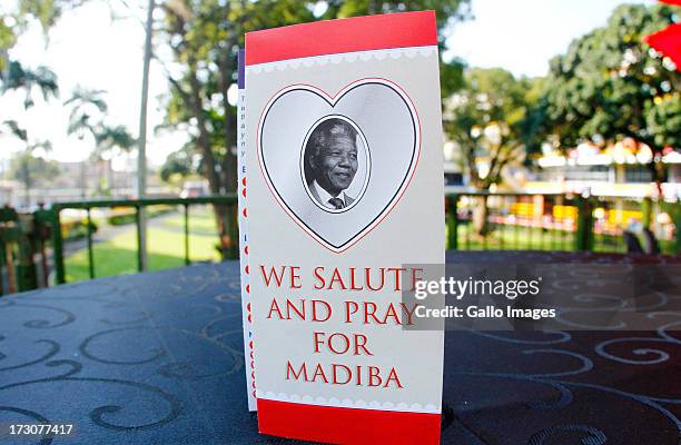 Tributes to former president Nelson Mandela are displayed during the 2013 Vodacom Durban July at Greyville Racecourse on July 06, 2013 in Durban,...