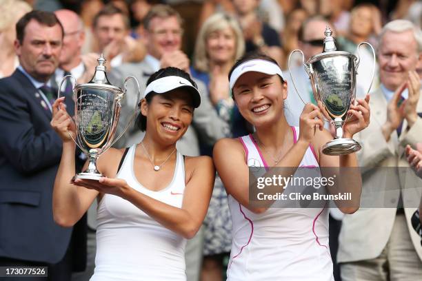 Shuai Peng of China and Su-Wei Hsieh of Taipei smile as they pose with the Ladies' Doubles trophies after their Ladies' Doubles final match against...