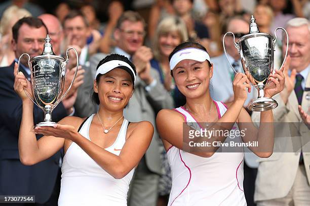 Shuai Peng of China and Su-Wei Hsieh of Taipei smile as they pose with the Ladies' Doubles trophies after their Ladies' Doubles final match against...