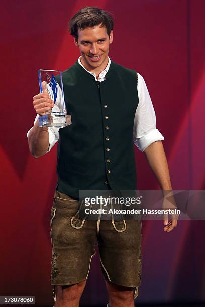 Felix Neureuther receives the Bavarian Sportaward 2013 during the Bavarian Sport Award gala at BMW Welt on July 6, 2013 in Munich, Germany.