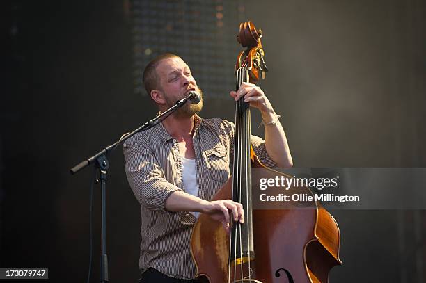 Ted Dwane of Mumford & Sons performs at their biggest headline show to date during the Summer Stampede tour at Olympic Park on July 6, 2013 in...