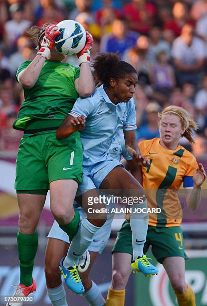 Australia goalkeeper Brianna Davey catches the ball in front of France forward Elodie Thomis on July 6, 2013 during a friendly women's football match...