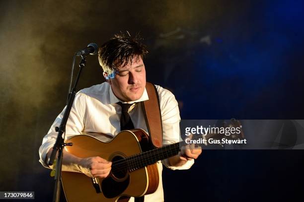 Marcus Mumford of Mumford & Sons performs on stage at The Summer Stampede at Queen Elizabeth Olympic Park on July 6, 2013 in London, England.