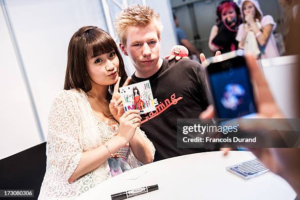 Singer Natsuko Aso attend a talk and autograph session at the 'TOYOTA x STUDIO4AC meets ANA PES' booth during the Japan Expo at Paris-nord Villepinte...