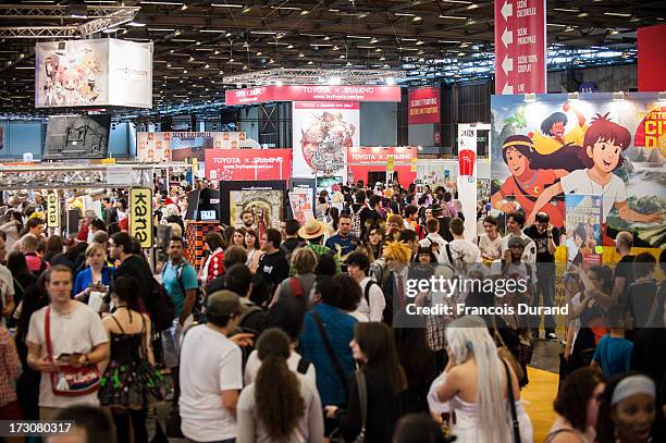 General view of the crowd at the 'TOYOTA x STUDIO4AC meets ANA PES' booth during the Japan Expo at Paris-nord Villepinte Exhibition Center on July 6,...