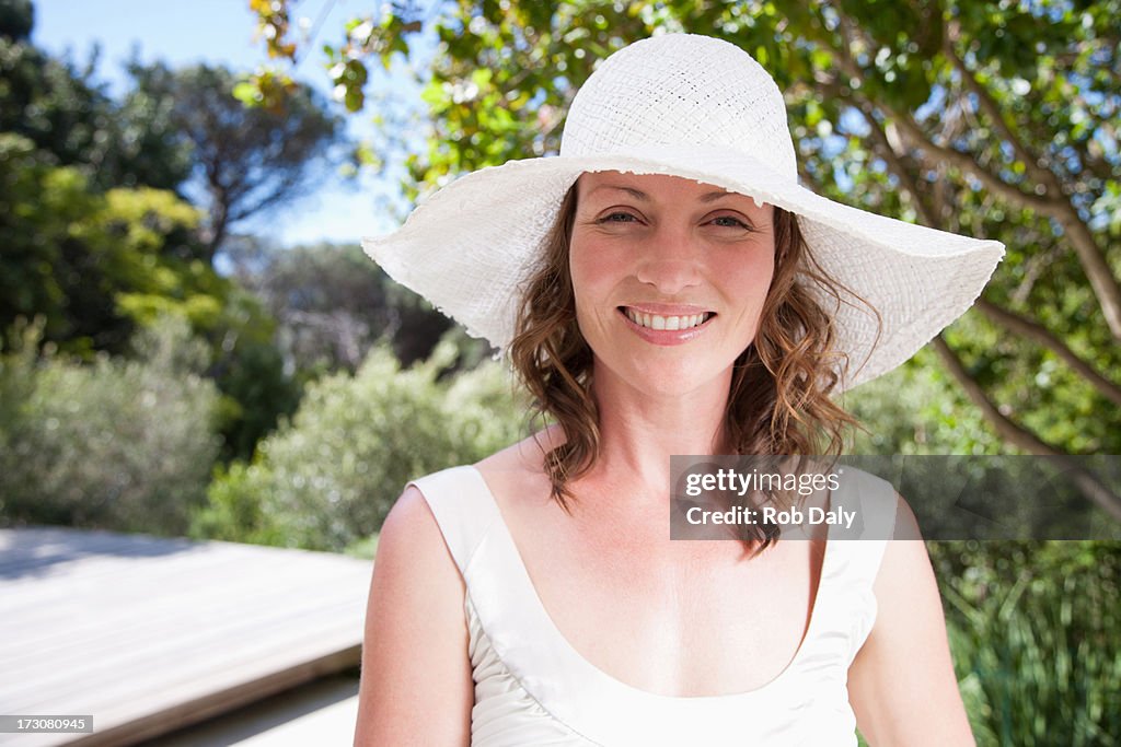 Smiling woman wearing sun hat