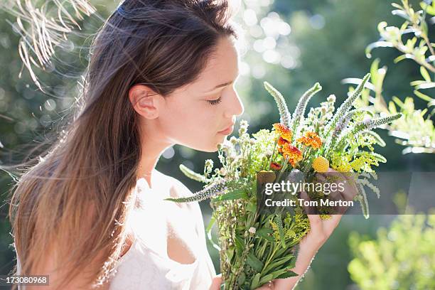 woman holding bouquet of flowers - beautiful woman nature stock pictures, royalty-free photos & images