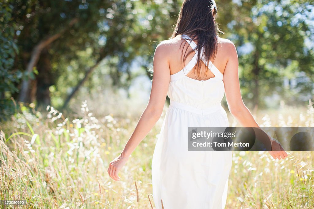 Woman walking in field