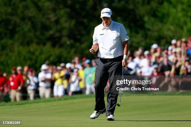 Johnson Wagner reacts after a birdie on the 18th hole during round three of the Greenbrier Classic at the Old White TPC on July 6, 2013 in White...