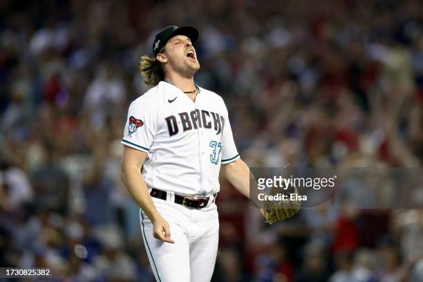 Kevin Ginkel of the Arizona Diamondbacks reacts after getting the third out of the eighth inning against the Los Angeles Dodgers during Game Three of...