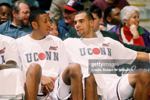 University of Connecticut basketball players Donyell Marshall and Donny Marshall talk on the bench, Hartford, Connecticut, 1994.