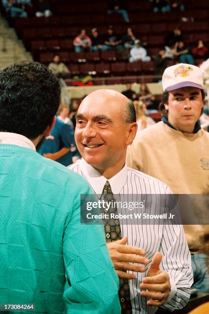 Sports journalist Dick Vitale of ESPN talks with several people before a game, Hartford, Connecticut, 1995.
