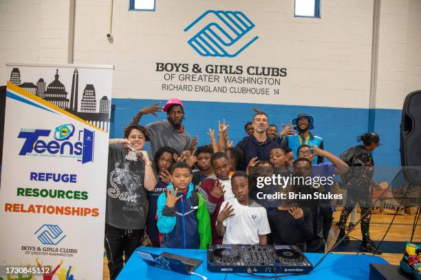 Boys & Girls Club Of Greater Washington staff and guests pose during Kickz For Kids at Boys & Girls Club Of Greater Washington on October 11, 2023 in...