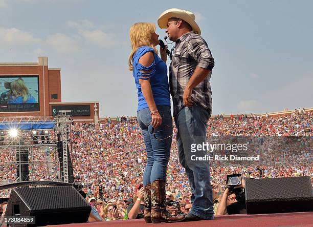 Trisha Yearwood and Garth Brooks perform during the Oklahoma Twister Relief Concert to benefit United Way of Central Oklahoma May Tornadoes Relief...