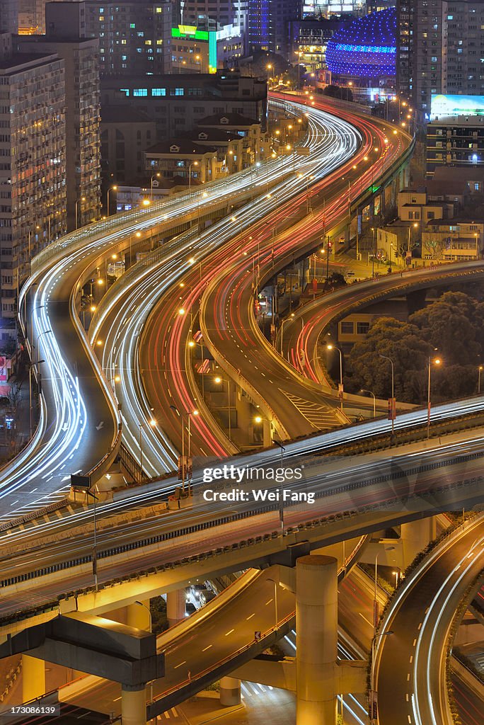 High-angle night view of a multi-stack motorways