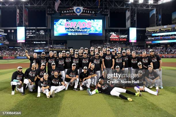 The Arizona Diamondbacks pose for photos after beating the Los Angeles Dodgers 4-2 in Game Three of the Division Series at Chase Field on October 11,...