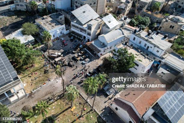 This picture taken on October 18, 2023 shows an aerial view of the complex housing the Ahli Arab hospital in Gaza City in the aftermath of an...