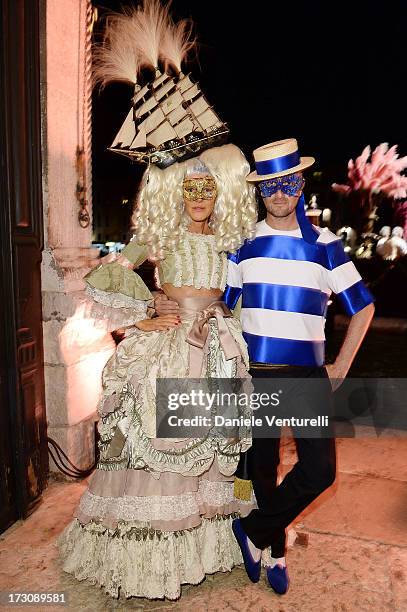 Anna Dello Russo and Marco Braga attend the 'Ballo in Maschera' to Celebrate Dolce&Gabbana Alta Moda at Palazzo Pisani Moretta on July 6, 2013 in...