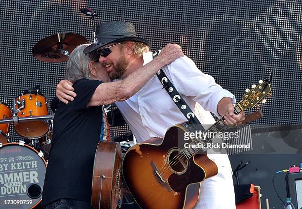 Musicians Willie Nelson and Toby Keith perform during the Oklahoma Twister Relief Concert to benefit United Way of Central Oklahoma May Tornadoes...