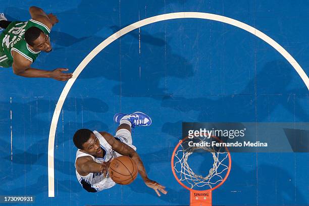 Doron Lamb of the Orlando Magic shoots against Jordan Crawford of the Boston Celtics on April 13, 2013 at Amway Center in Orlando, Florida. NOTE TO...