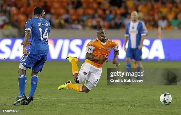 Oscar Boniek Garcia of the Houston Dynamo is tripped up by Amobi Okugo of the Philadelphia Union in the second half at BBVA Compass Stadium on July...