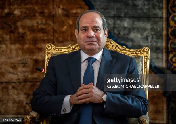 Egypt's President Abdel Fattah al-Sisi sits with the German Chancellor during their meeting in Cario on October 18, 2023. German Chancellor Olaf...