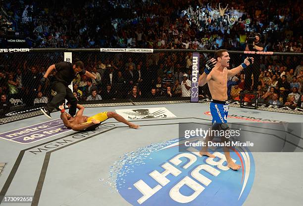 Chris Weidman reacts to his knockout victory over Anderson Silva in their UFC middleweight championship fight during the UFC 162 event inside the MGM...