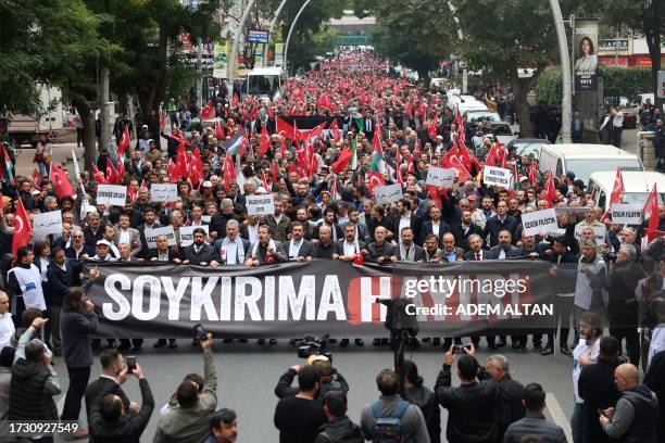 Demonstrators holding a banner which reads "No to Genocide" march from Kocatape Mosque to Abdi Ipekci Park in Ankara in support of Palestinians on...