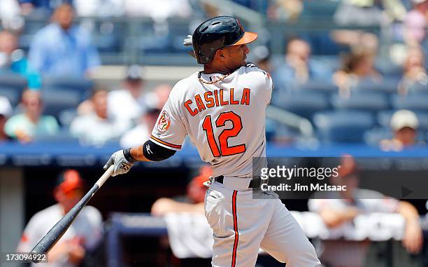 Alexi Casilla of the Baltimore Orioles follows through on a RBI base hit against the New York Yankees at Yankee Stadium on July 6, 2013 in the Bronx...