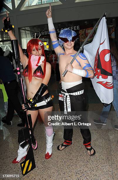 Cosplayers Sammie Gibson and Josh Sheldon attend the Anime Expo 2013 held at The Los Angeles Convention Center on July 6, 2013 in Los Angeles,...