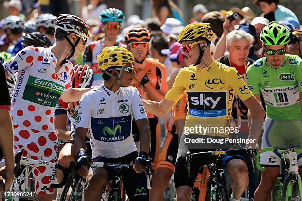 Pierre Rolland of France and Team Europcar wearing the King of the Mountain jersey, Quintana Rojas of Colombia and Movistar Team wearing the Best...