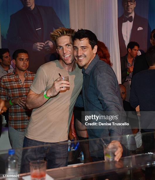 James Garrett and Jonathan Knight attend Pure Nightclub at Caesars Palace on July 6, 2013 in Las Vegas, Nevada.