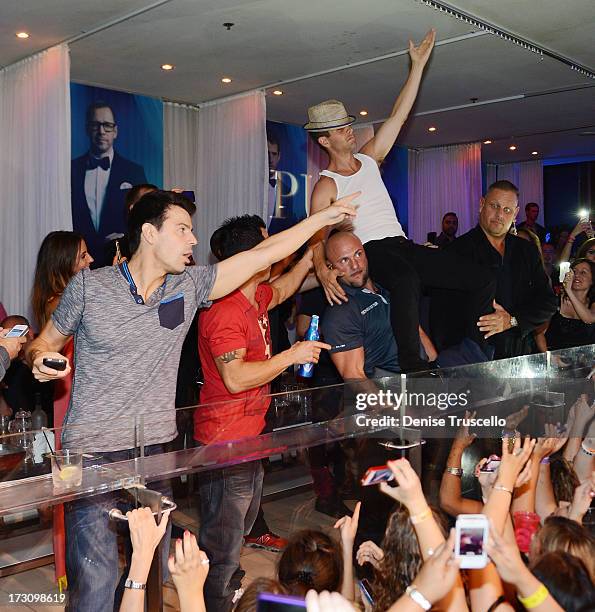 Jordan Knight, Danny Wood and Joey McIntyre of New Kids On The Block host at Pure Nightclub at Caesars Palace on July 6, 2013 in Las Vegas, Nevada.