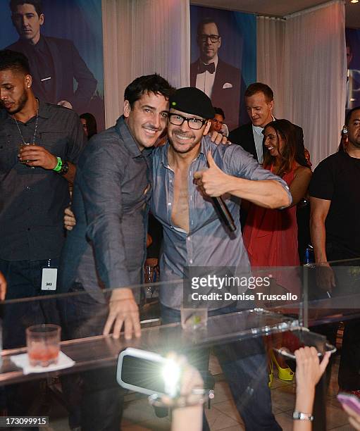 Jonathan Knight and Donnie Wahlberg of New Kids On The Block host at Pure Nightclub at Caesars Palace on July 6, 2013 in Las Vegas, Nevada.