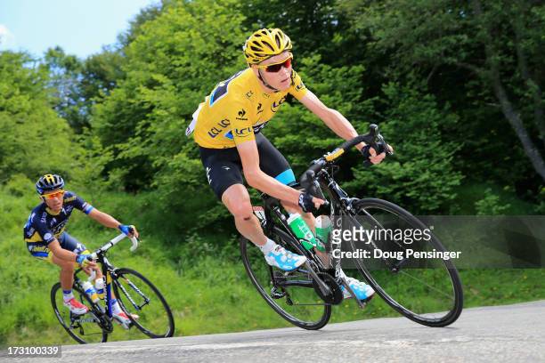 Race leader Chris Froome of Great Britain and Sky Procycling is followed by Alberto Contador of Spain and Team Saxo-Tinko on the decent of the Col De...