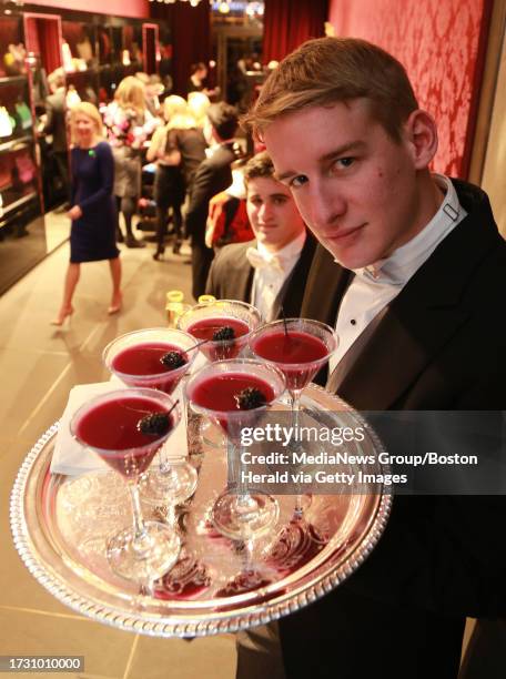 Tim Dombeck serves "French Martini Revisted" : vodka, pineapple juice, and raspberry pure at a party at Dolce & Gabbana on Newbury Street hosted by...