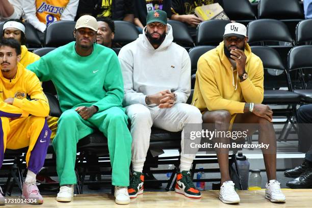 Jarred Vanderbilt, Anthony Davis and LeBron James sit on the bench during a basketball game between the Los Angeles Lakers and the Sacramento Kings...
