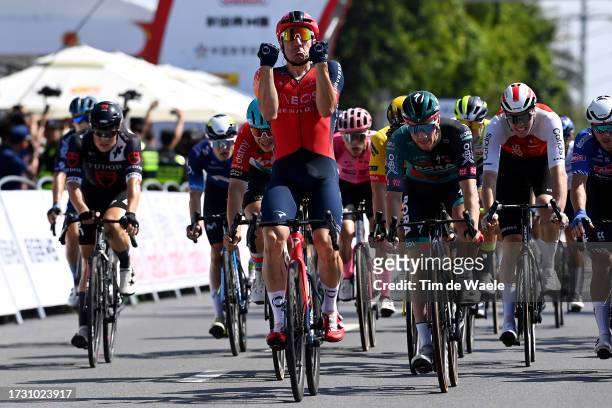 Elia Viviani of Italy and Team INEOS Grenadiers celebrates at finish line as stage winner ahead of Sam Bennett of Ireland and Team BORA-Hansgrohe and...