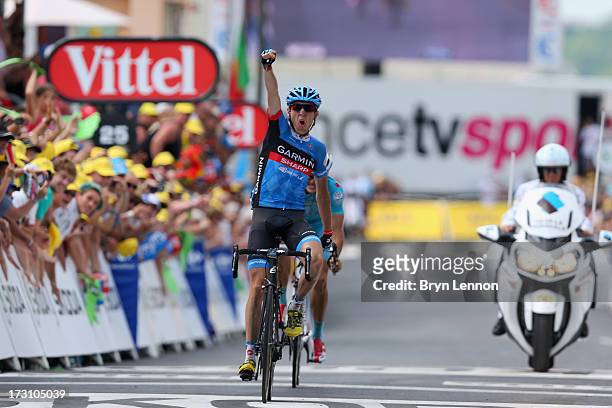 Daniel Martin of Ireland and Team Garmin-Sharp celebrates winning the stage as he crosses the finish line during stage nine of the 2013 Tour de...