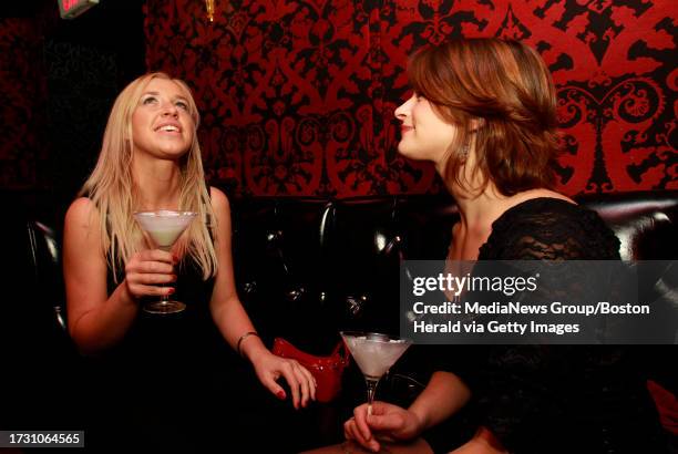 Boston, MA - Agnes Vorbrodt of Brockton and Laura Thomason of Canton enjoy a Key Lime Martini in the lounge at Storyville on Saturday December 17,...