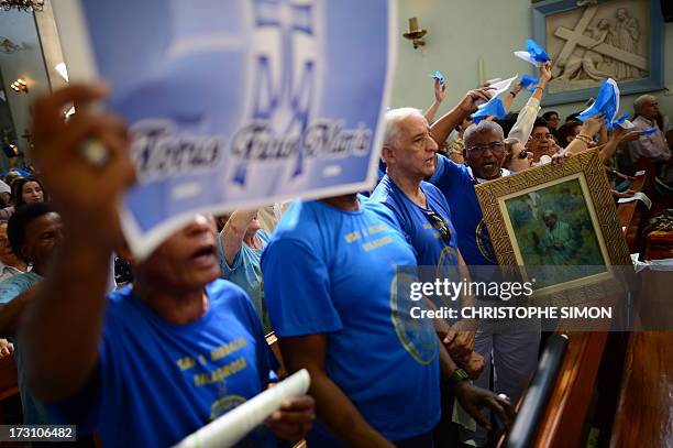 Faithful attend the mass officiated by Cardinal Stanislaw Rylko to celebrate the arrival in Brazil of the relics of blessed John Paul II at the...